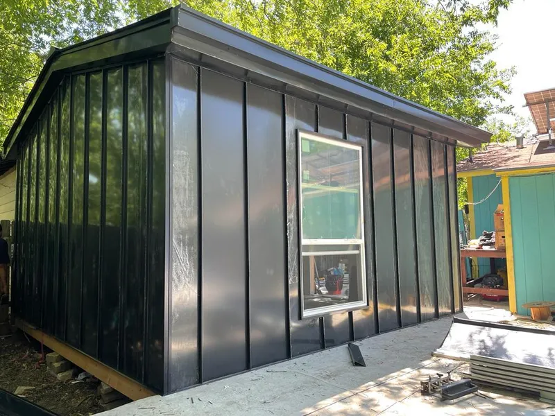 Black standing seam metal wall panels for Metal Roof Installation in Lake of the Woods