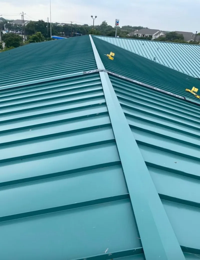 Green commercial metal roof ridge and valley for Metal Roof Repair in Lake of the Woods